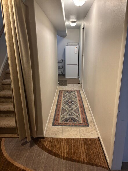 Hall to 2nd bedroom and kitchenette - 3740 E 99th Way