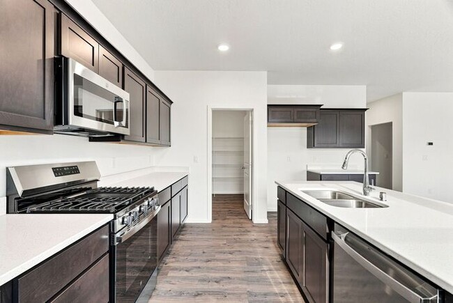 Building Photo - Spacious 5-Bedroom with Loft with 3-Car Garage