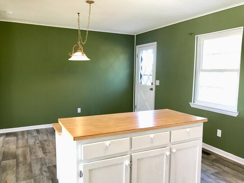 Kitchen with eat in dining. New back porch out the door. - 9225 Amos Rd