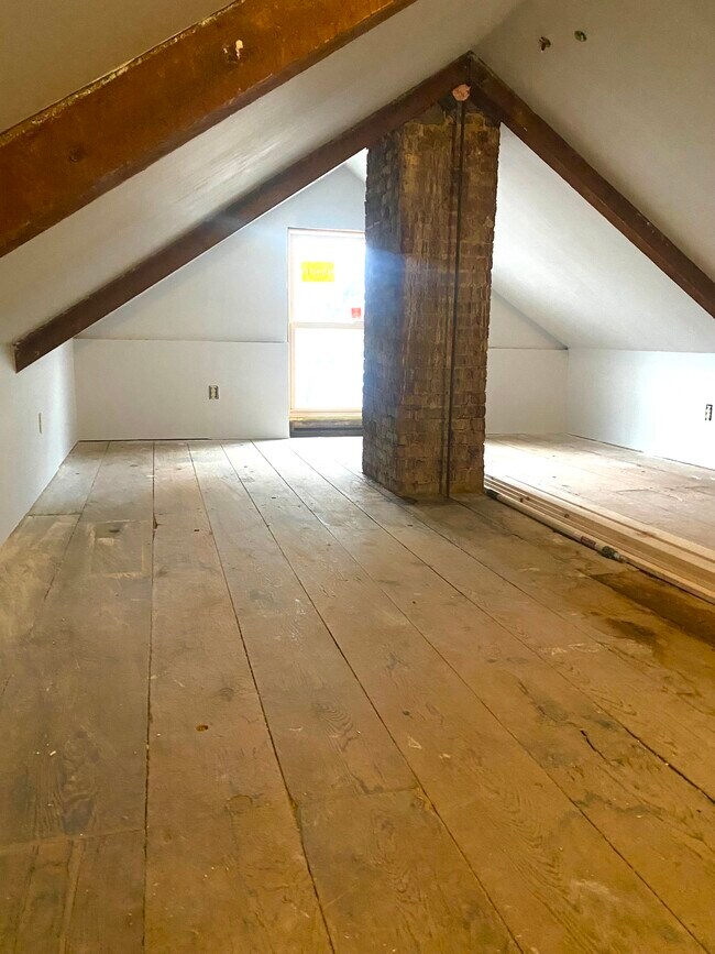 newly renovated attic with 5" insulation and custom window - 183 Main St
