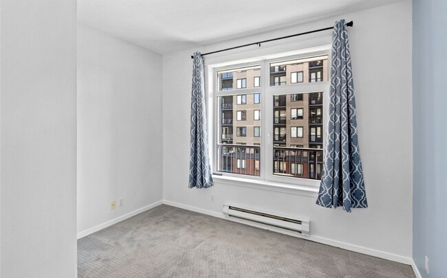 Building Photo - Chic 1-Bedroom Condo with Stunning City & ...