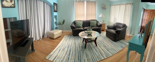 Beautiful living room with overstuffed couches - 5119-1 Avenue Q