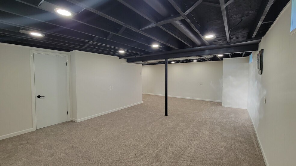 Partially finished basement with new carpeting, paint, trim, lighting and remodeled bathroom.. - 6305 49th Ave