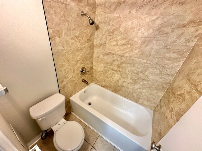 Experience luxury in a sleek and modern bathroom design. - Country Club