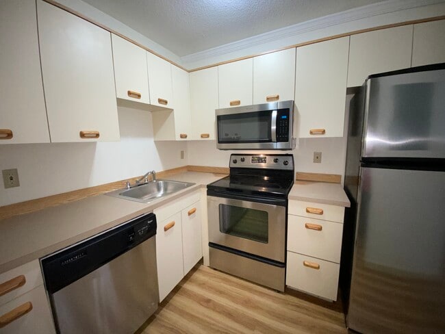 Kitchens with Stainless Steel Appliances - Opera Block Apartments