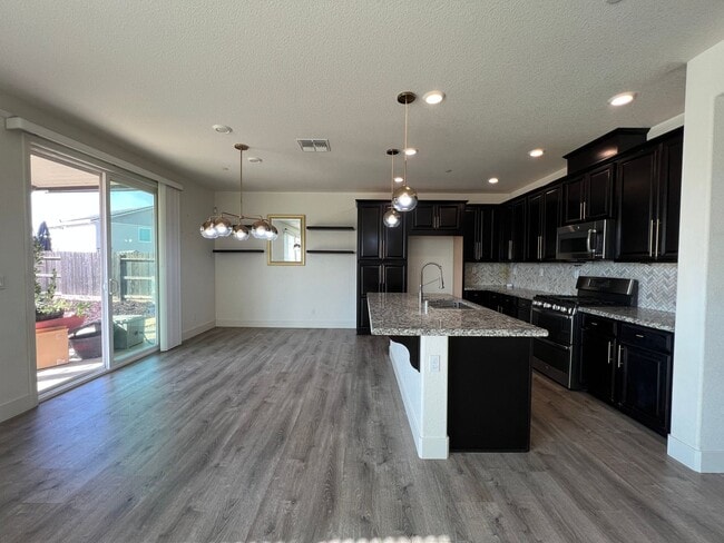 Building Photo - Beautiful 4 Bedroom Home With Low Maintenance Landscaping And Updated Interior