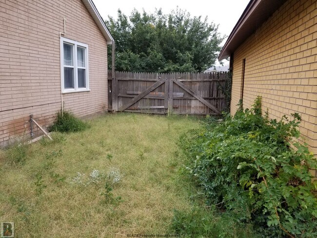 Building Photo - Massive Corner-Lot Home with Retro Charm & Shady Backyard!