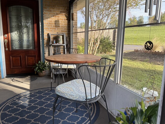 Seating on screen porch - 3311 River Rd