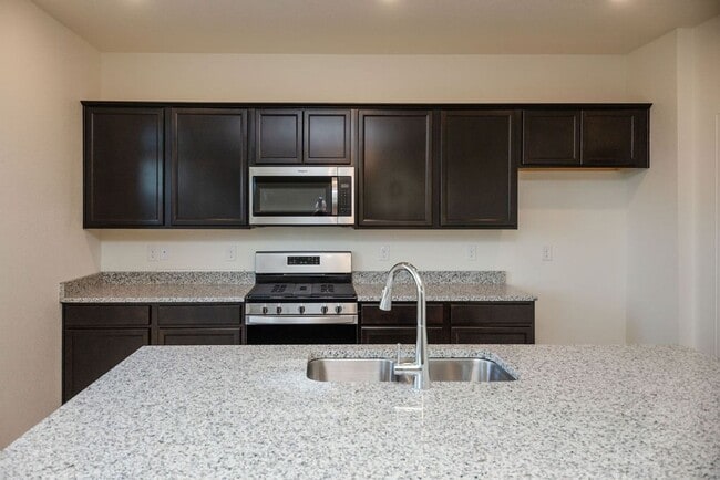 Building Photo - Spacious 4-Bedroom Home with 3-Car Garage & Walk-Out Basement | Prime Living Opportunity