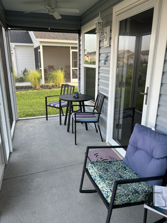 Screened in front patio with shades - 4823 Angela Ave