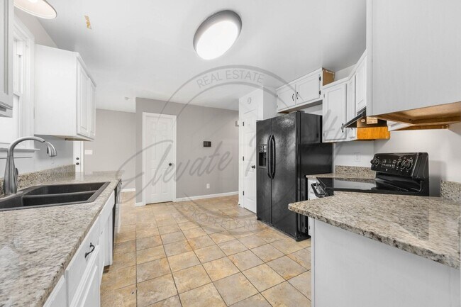 Building Photo - Four Bedroom Two Story with Two Car Garage...