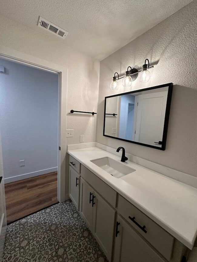 Building Photo - Updated Home with Island Kitchen, LVP Flooring, and Yard Care Included!