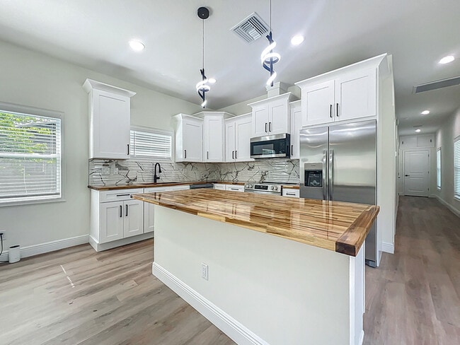 Building Photo - BRAND NEW CONSTRUCTION in the Heart of Pla...
