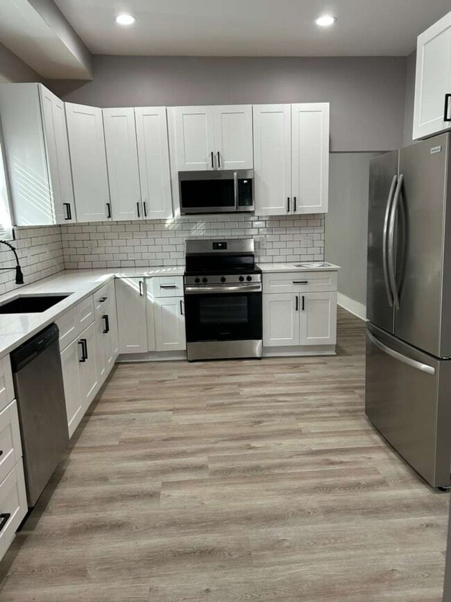 Building Photo - MOVE IN SPECIAL - Modern, Chic and brand new 2 bedroom with an office -   Discover This Home That...