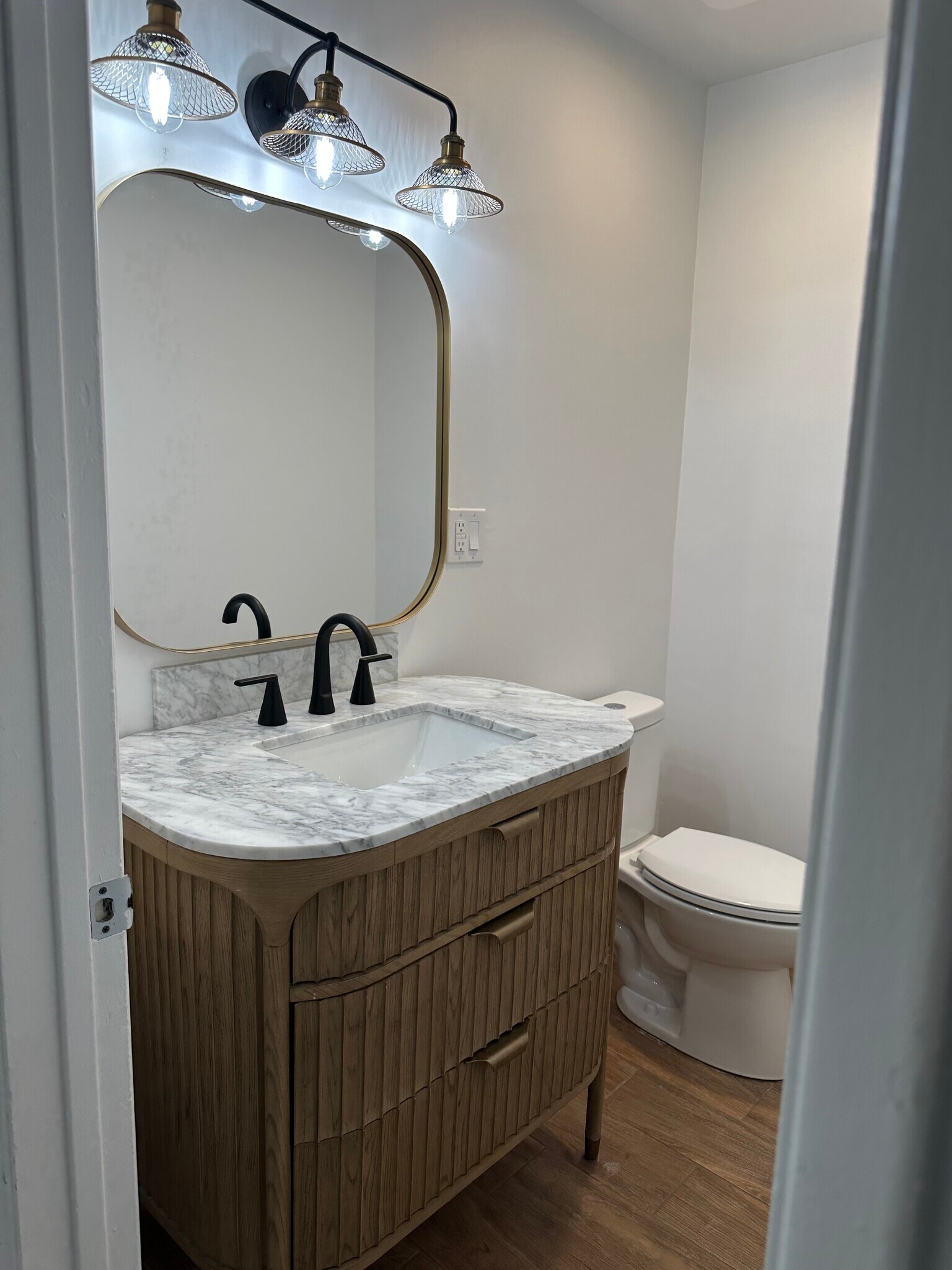 1st Floor 1/2 Bath with Custom Cabinet and Marble Countertop - 2950 N Alvernon Way