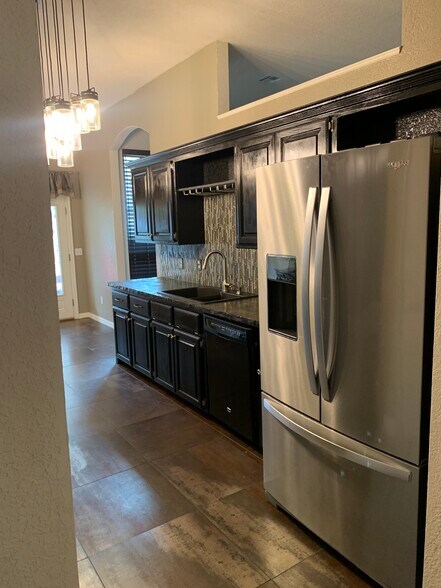 Concrete counters. New refrigerator. - 4517 Newport Dr