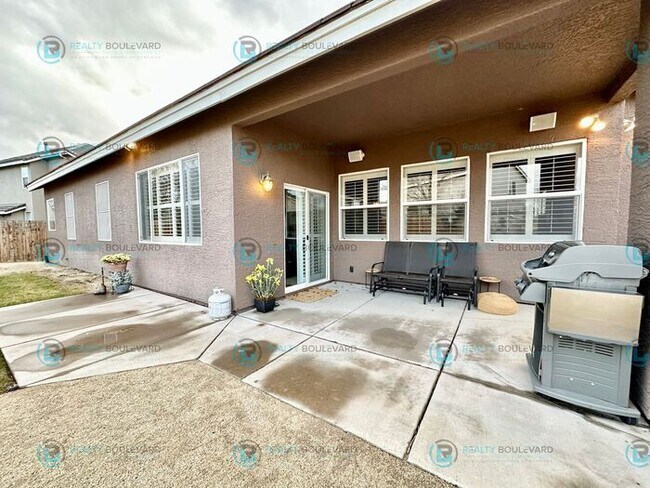 Building Photo - Open Kitchen, Expansive Living, and Covered Patio in Tranquil South Reno Near Trails, Parks & Sho...