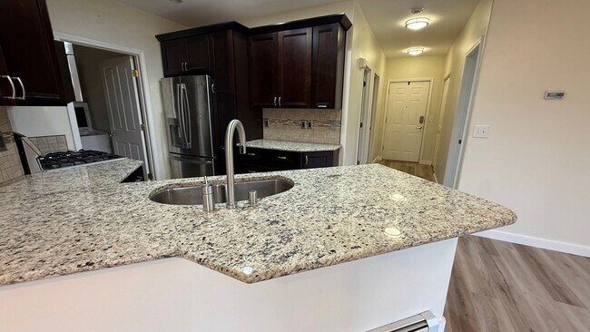 Building Photo - Major Updates! Raised Ranch Style Condo wi...