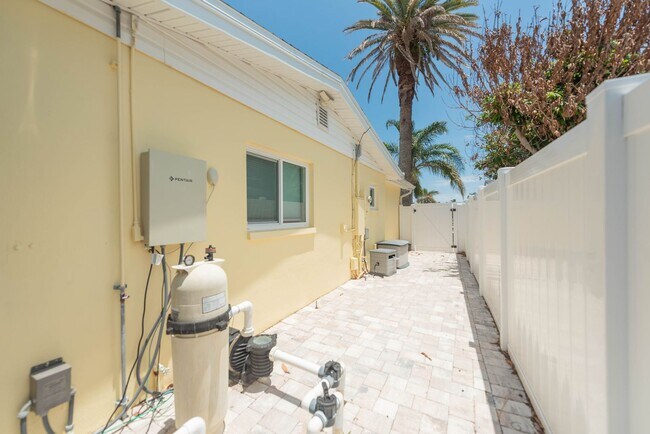 Building Photo - Live the ultimate Space Coast waterfront lifestyle at this stunning beachside canal home in Satel...