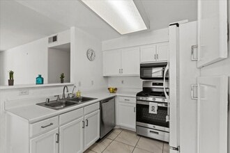 Building Photo - Bright, Modern 2 Bedroom Upstairs Condo, Community Pool, Gated, Covered Parking