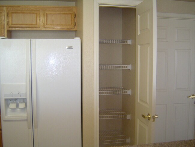 Building Photo - Move-In Ready Condo with Private Balcony & Modern Upgrades