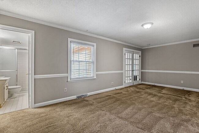 Building Photo - McLeansville - Minutes from Elon & Greensboro! Brick Duplex on a few Acres, Den, SS Appliances, F...