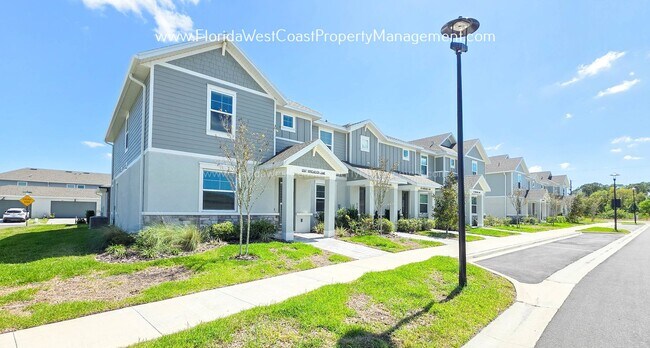 Building Photo - EXCEPTIONAL AND SPACIOUS FURNISHED TOWNHOME WITHIN WATERSIDE- NAUTIQUE!