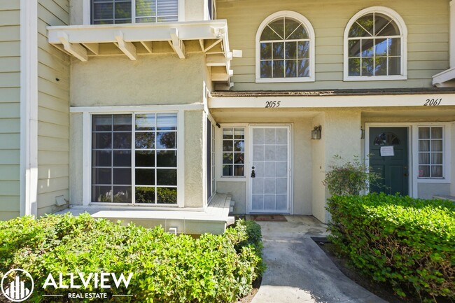 Building Photo - Fully Renovated 2 Bed Townhome with Private Patio, 2-Car Garage & Community Pool