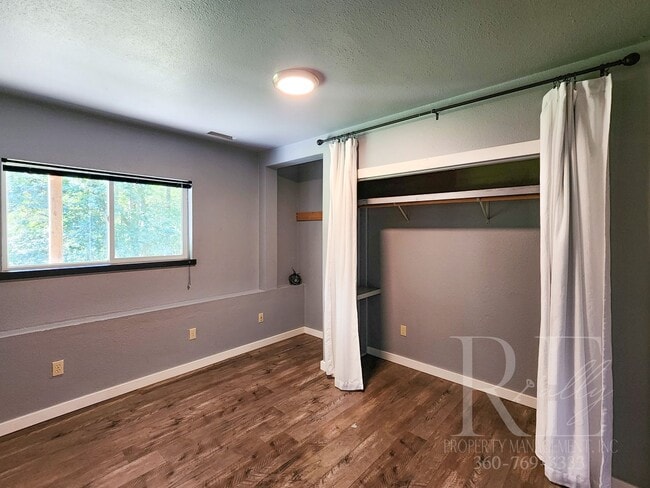 Building Photo - Vaulted Ceilings, Unique Designer Kitchen & Expansive Half-Acre Setting with Flexible Living Spaces