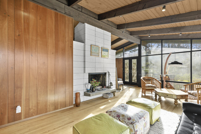 Another view of the living room featuring a fireplace. - 19 Cottontail Ln