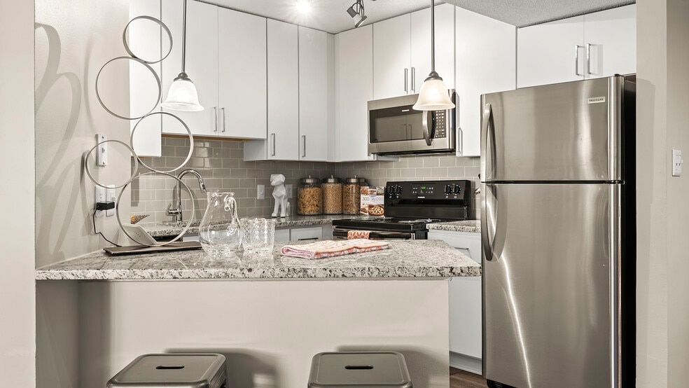 Modern kitchen with sleek finishes and stainless steel appliances - Buckhead and Vine