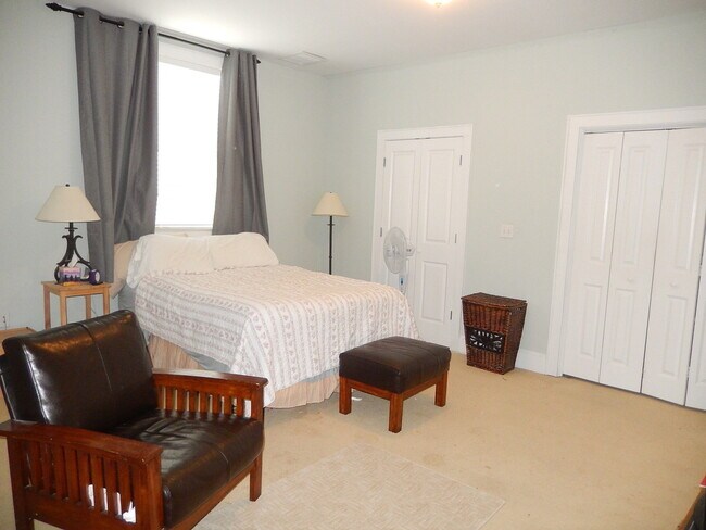 Building Photo - GLAMOROUS 3/2.5 w/ Pond View, Deck, Stainless Appliances, Wood Floors, Fireplace, & More! $2150/m...