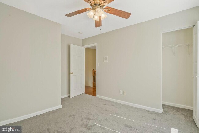 Building Photo - This beautifully maintained brick-front, three-level townhome is located in a highly sought-after...