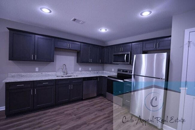 Building Photo - Move in special $650!! Luxury 2 bed, 1 bath duplex - new construction!! Washer and dryer and util...