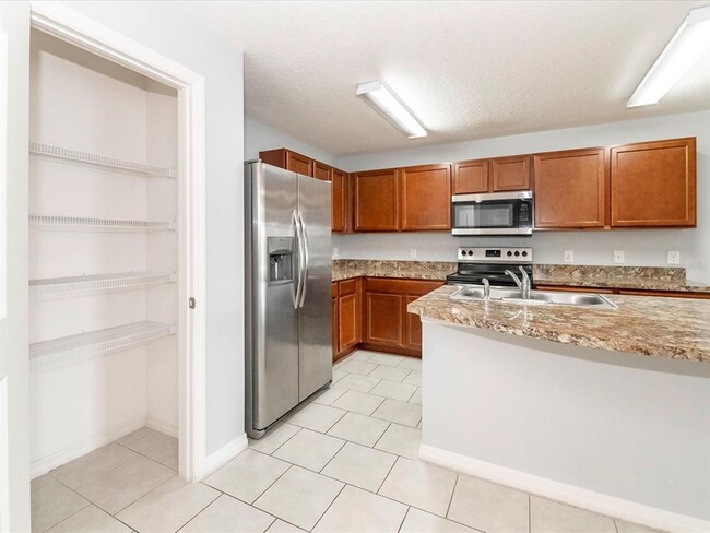 Building Photo - 5555 Maggiore Blvd