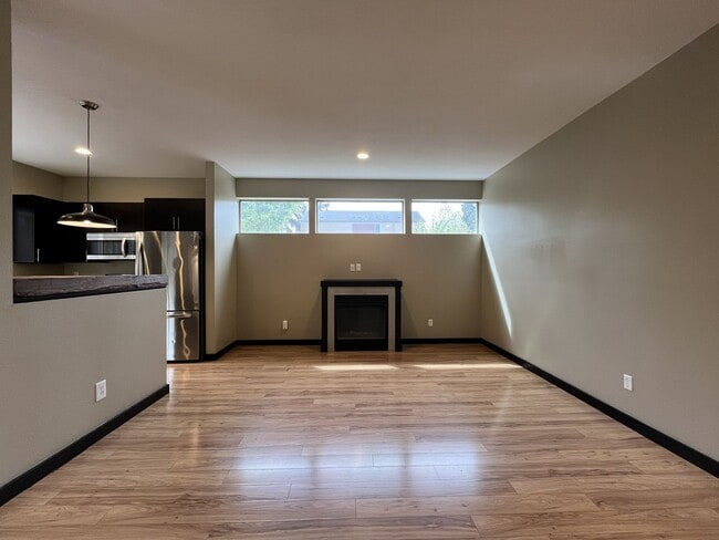 Building Photo - Charming 3 Bedroom, 2.5 Bathroom Home with Large Living Room, Tall Windows, Island Kitchen, and A...