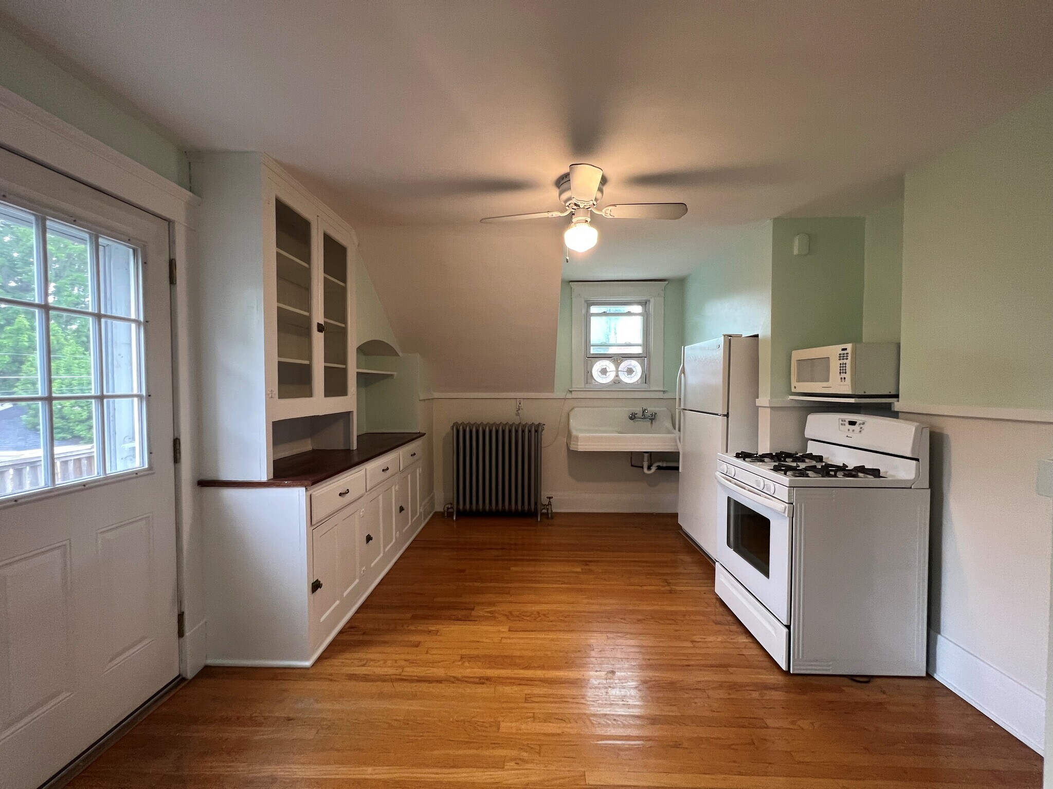 Kitchen w/ ceiling fan, new fridge, gas stove and microwave. - 61 Hirschfield Dr