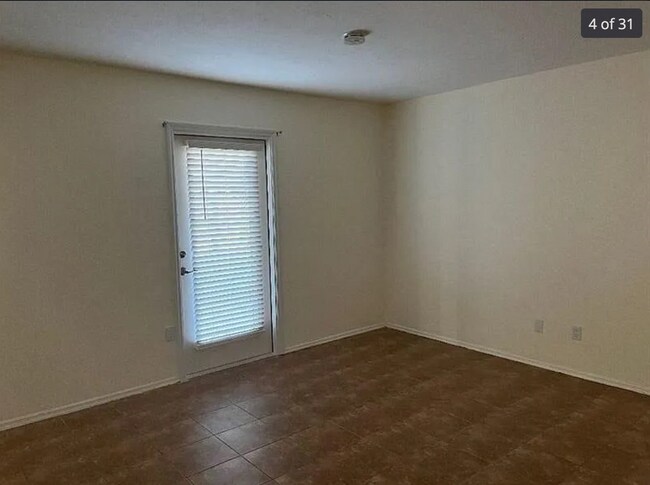 Building Photo - 2/2/1 home with a spacious fenced backyard...