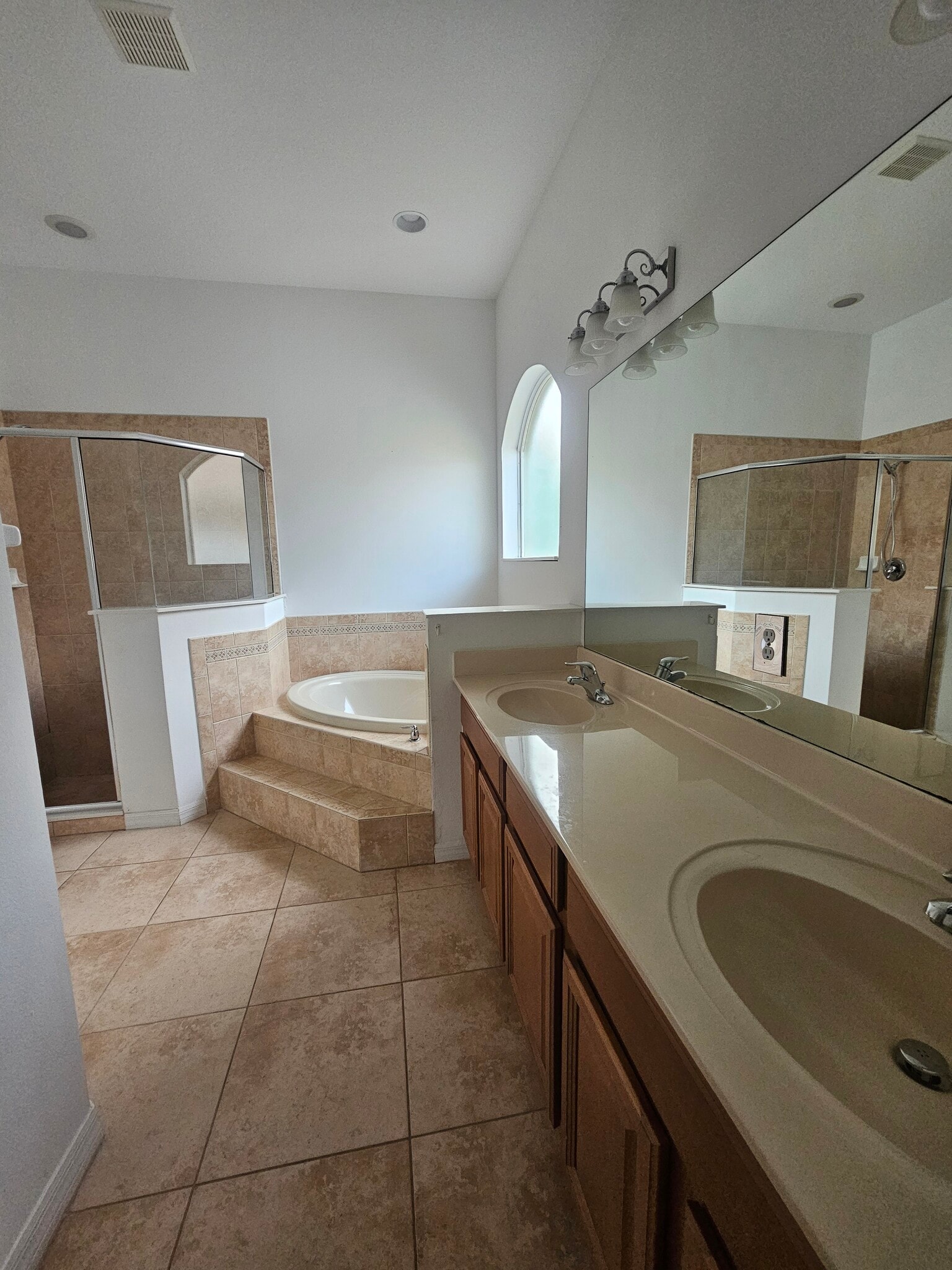 Large master suite bathroom with shower, huge tub, tons of natural sunlight, & double sinks - 3615 Soft Breeze Cir