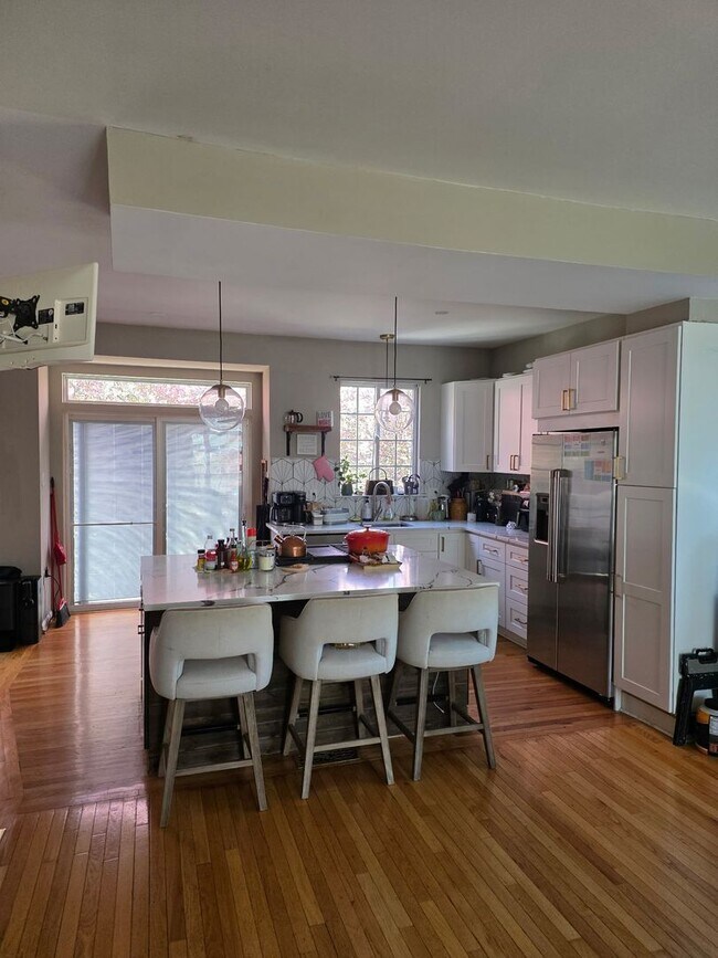 Building Photo - Stunning 3–4 Bedroom Townhome in Private Community | Garage + EV Charger | Deck with Tree Views