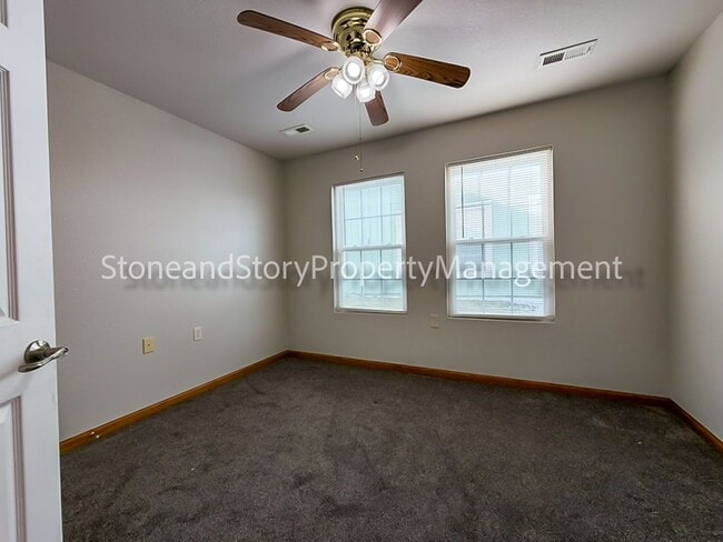 Building Photo - 2 bedroom 1.5 bath duplex with sunroom, 2 car garage and fenced yard