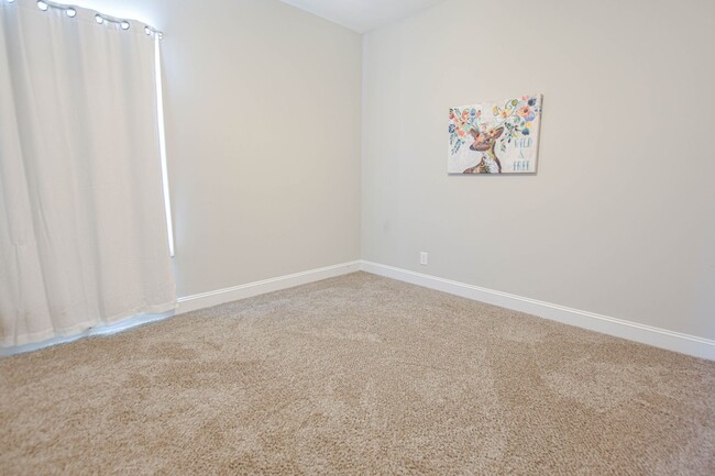 Building Photo - Pet Friendly Three Bedroom with Bonus!