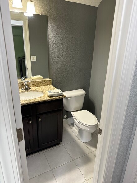 Half bath downstairs. - 611 Veery St