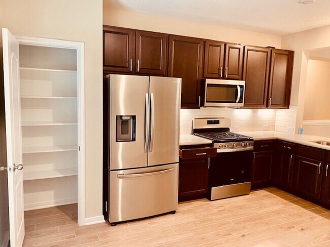 Building Photo - Willow Wood community features a brick ele...