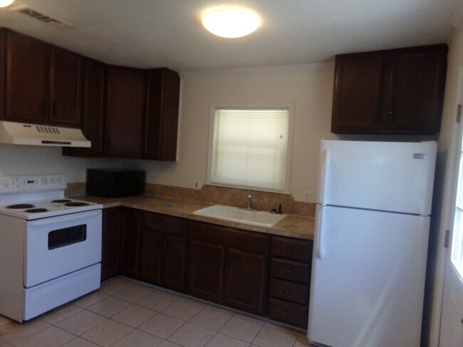 Building Photo - 2BR/1BA Milton Duplex with Huge Fenced Backyard, Tile Flooring Throughout & Convenient Access to ...