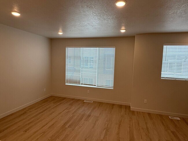 Building Photo - Half off first months rent - Beautiful townhome, construction just completed, 2 car garage, centr...