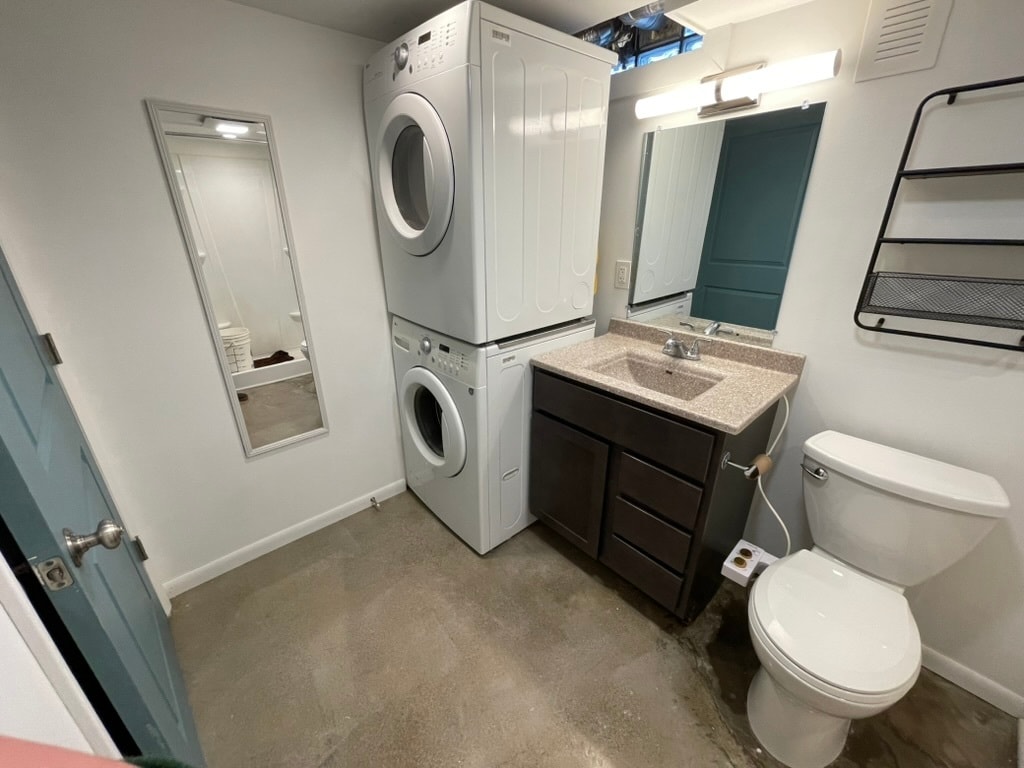 Stacked washer and dryer in bathroom - 2242 Prospect Ave NE