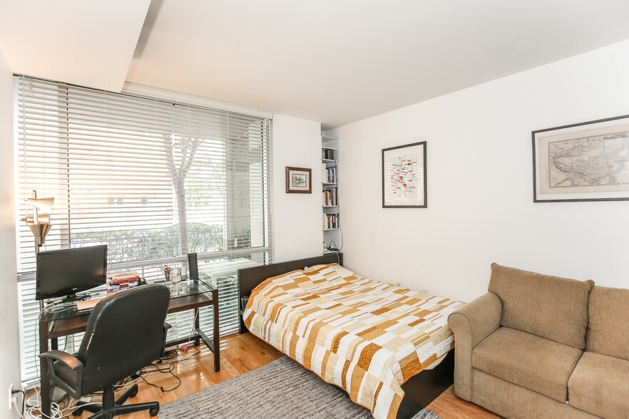 master bedroom - previous tenant had a desk, bed and a couch; in-unit metal shelving avail. corner - 1300 13th St NW