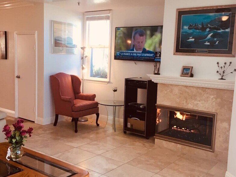 Remodeled fireplace ( wing armchair & dvd stand: NOT there) - 1400 Pacific Coast Hwy