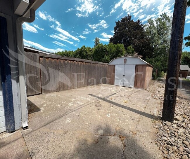 Building Photo - Three Bedroom, Two Bathroom House with Fenced Yard and Outdoor Fireplace